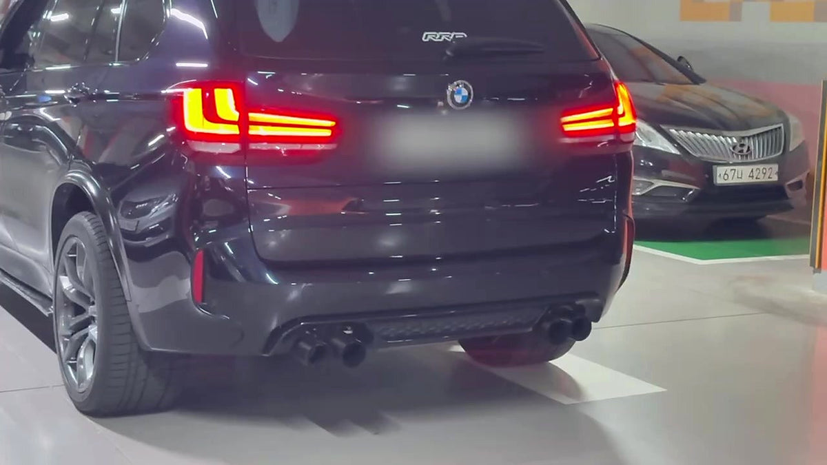 BMW X5 M (F85) on the road, valved SUS304 catback fitted, no number plate visible in frame