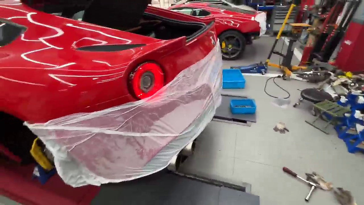 Ferrari F12 / 812 rear three-quarter, titanium valved axle-back fitted, number plate pixelated for privacy