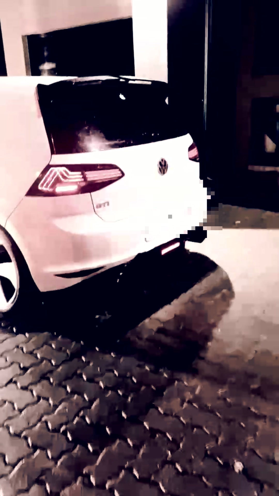 VW Golf 7 GTI with a valved titanium exhaust at night