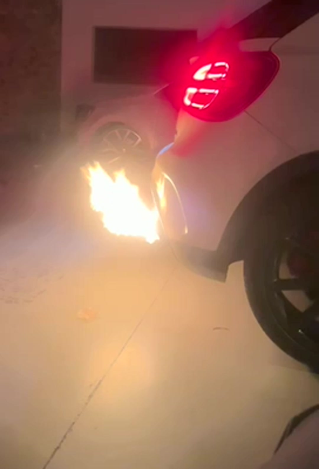 Mercedes-AMG GLA 45 X156 valved titanium exhaust in a garage with the rear LED tail light lit
